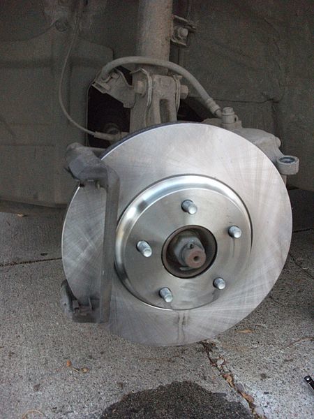 Put the new rotor on (clean with brake cleaner fluid first!) then fixed bit of the caliper goes on.