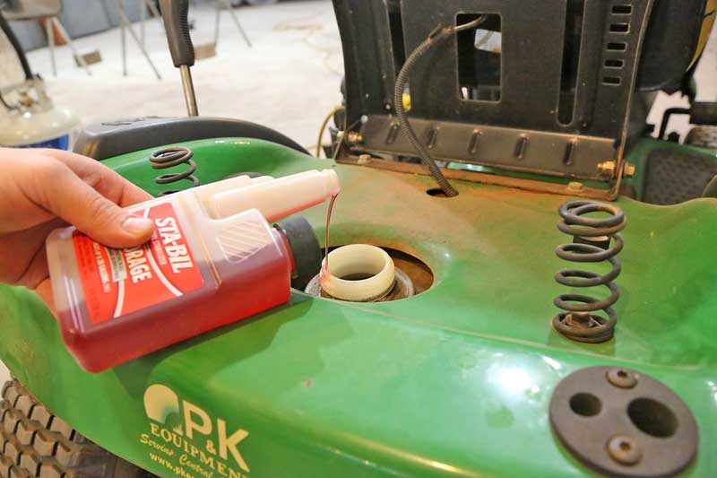 Next, pour STA-BIL? into the gas tank and replace the gas cap.