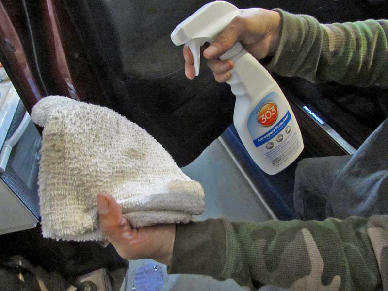 The best method is to spray the protectant onto a clean towel, this limits overspray.