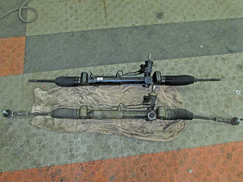 The new rack is on top, the old rack is on the bottom. They must be identical. 